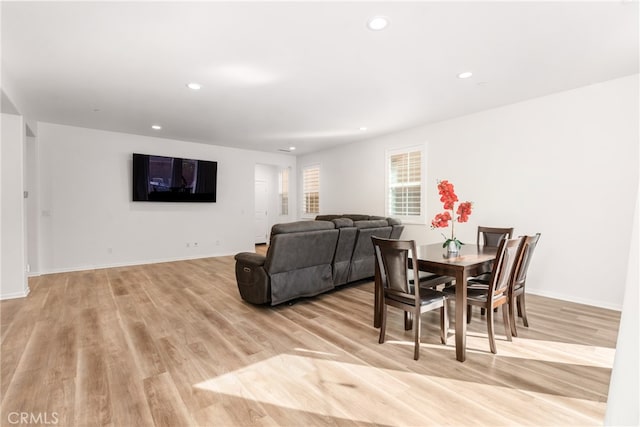 dining space with light hardwood / wood-style floors