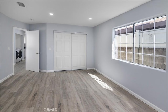 10125 Sharp Ave, Arleta, CA 91331 - unfurnished bedroom with washer and dryer, wood finished floors, baseboards, a closet, and recessed lighting