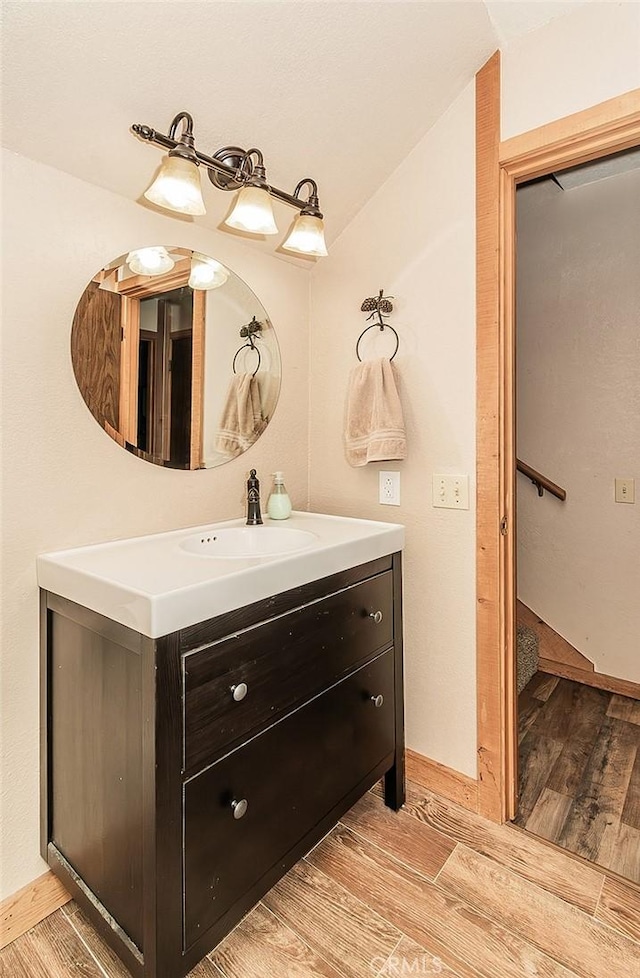 bathroom featuring wood-type flooring and vanity