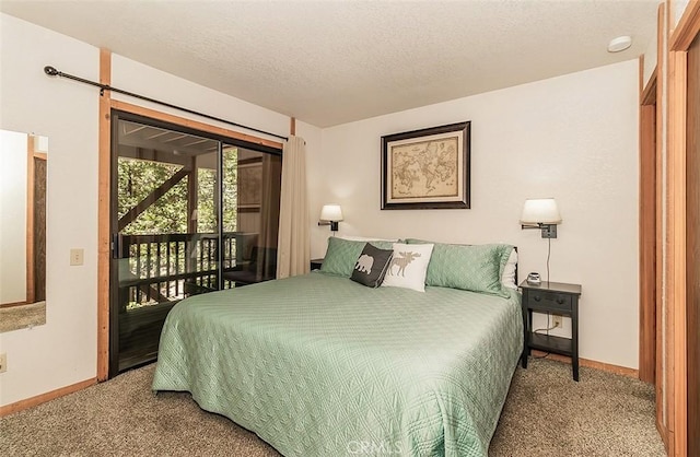 carpeted bedroom with a textured ceiling and access to outside