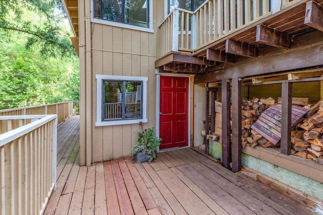 doorway to property featuring a wooden deck and a balcony