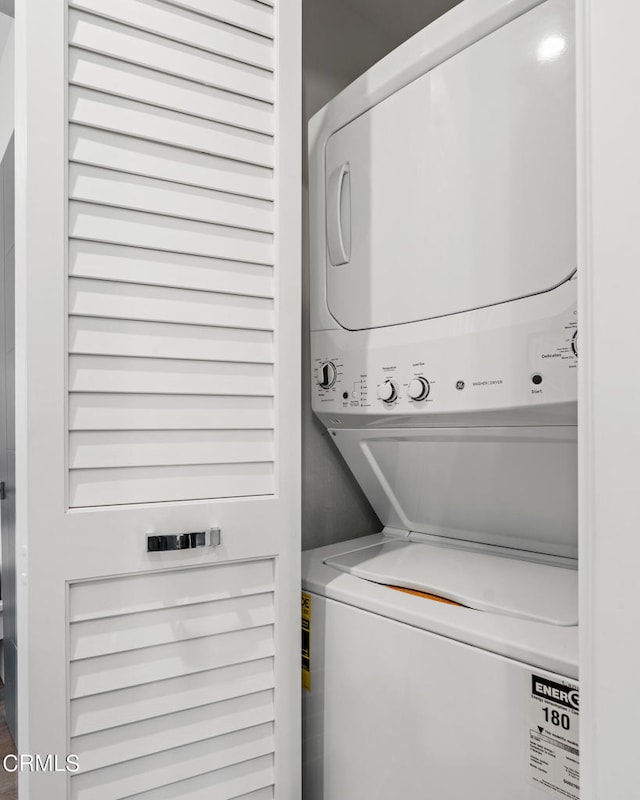 laundry area with stacked washer / drying machine