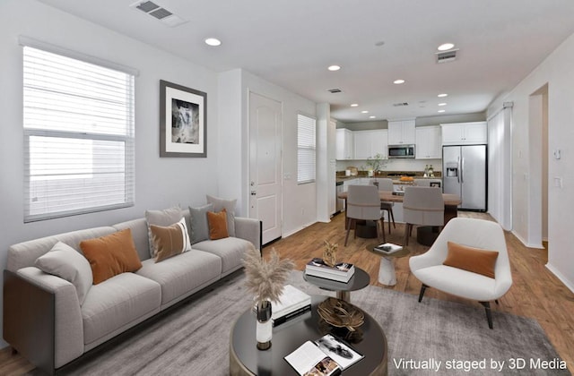 living room with light hardwood / wood-style flooring