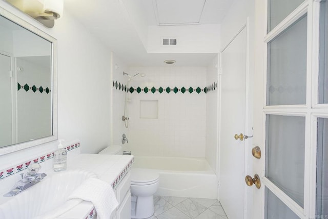 full bathroom with vanity, toilet, and tiled shower / bath combo