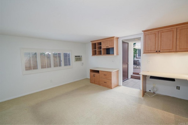 kitchen with a wall unit AC and light carpet