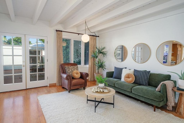 living room featuring french doors, hardwood / wood-style floors, and beam ceiling