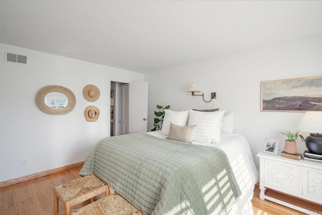 bedroom with wood-type flooring