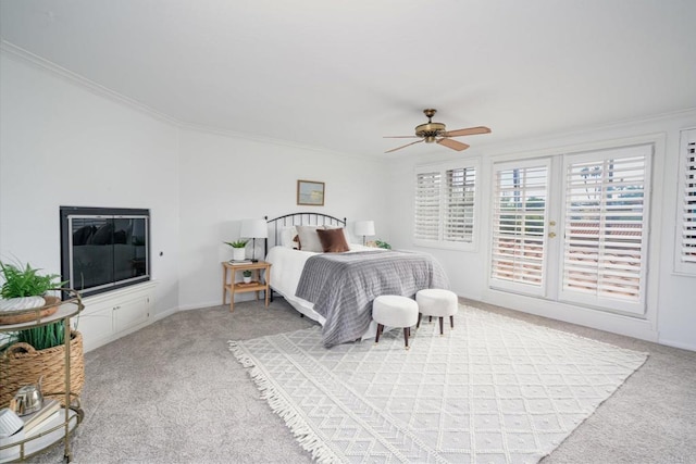 bedroom with crown molding, ceiling fan, and light colored carpet