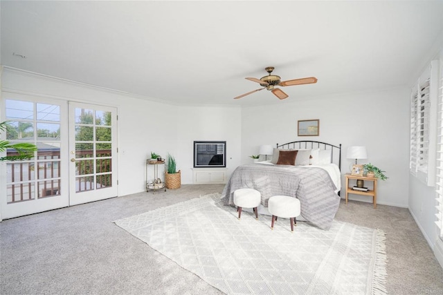 bedroom with ceiling fan, access to outside, ornamental molding, french doors, and light carpet