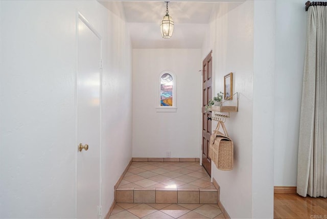 hallway with light tile patterned floors