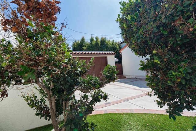 view of property exterior featuring a patio