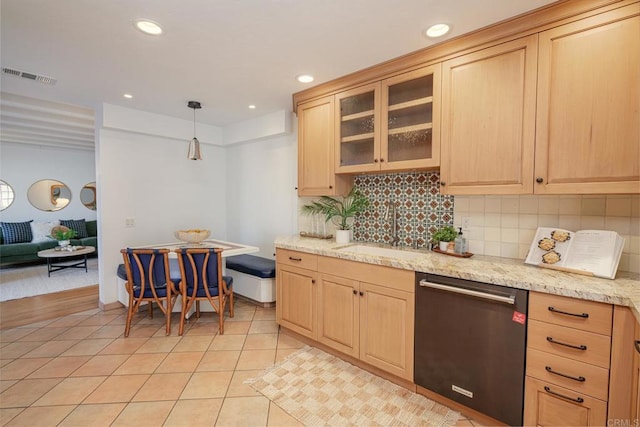 kitchen with pendant lighting, sink, light brown cabinets, and dishwasher