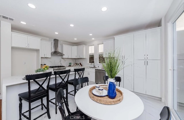 dining space with plenty of natural light and sink