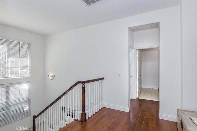 corridor featuring dark hardwood / wood-style floors