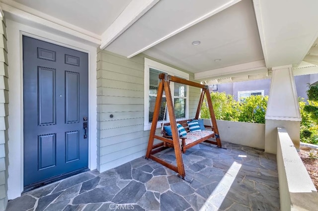 doorway to property featuring a porch