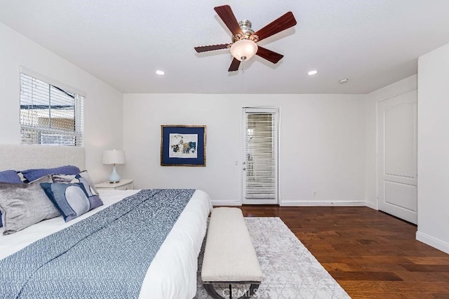 bedroom featuring ceiling fan and dark wood-type flooring