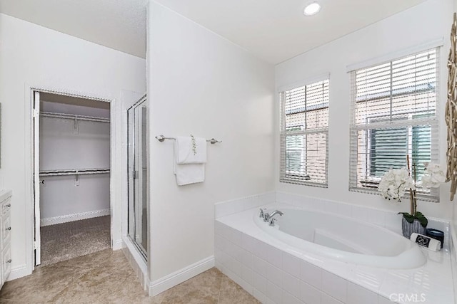 bathroom with tile patterned floors and plus walk in shower