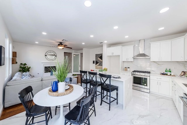 dining space featuring ceiling fan