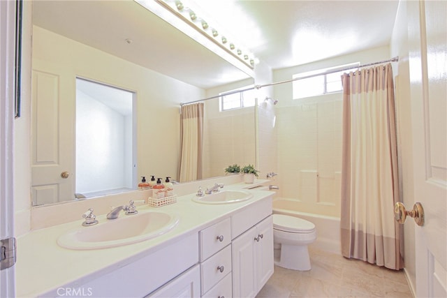 full bathroom featuring vanity, shower / bath combo, and toilet