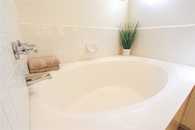 bathroom with a tub to relax in