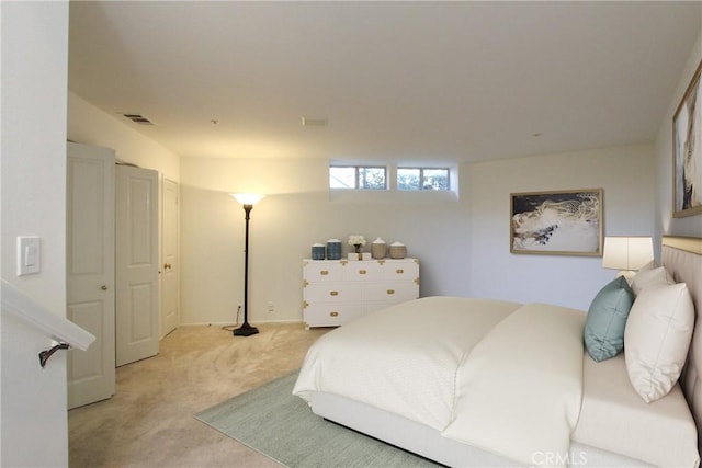 bedroom with light carpet