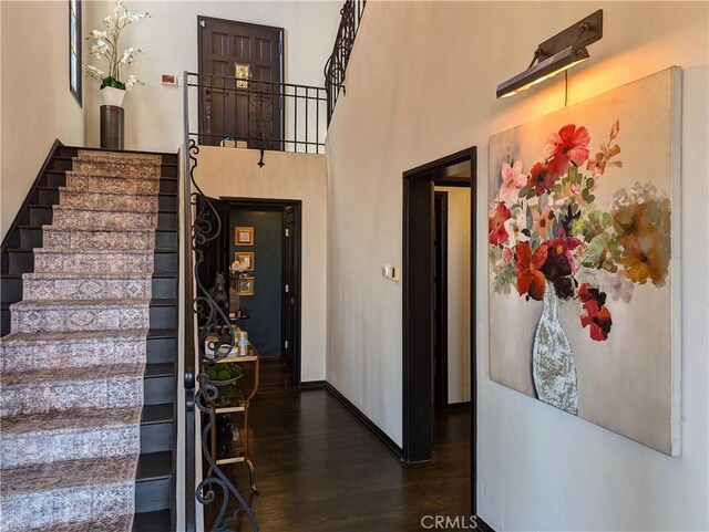 stairs featuring hardwood / wood-style flooring