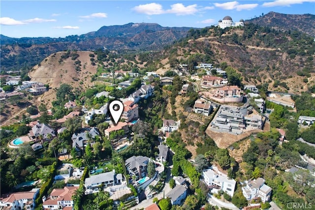 birds eye view of property with a mountain view and a residential view