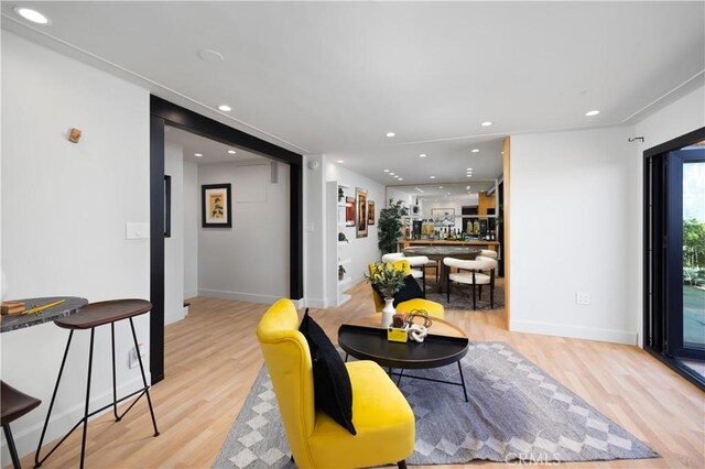 living room with light hardwood / wood-style flooring