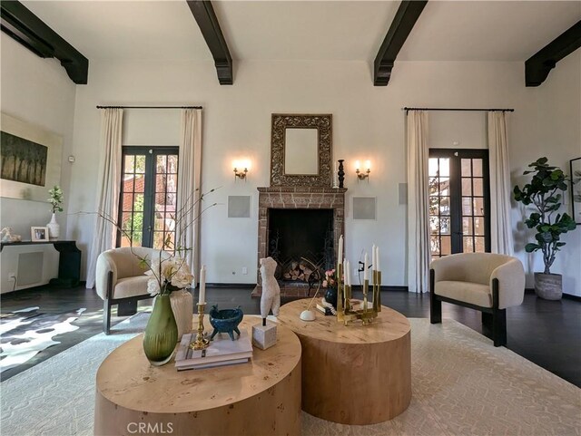 living room with french doors and beam ceiling