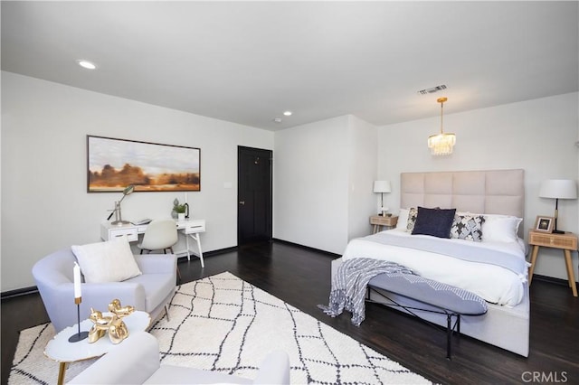 bedroom featuring recessed lighting, wood finished floors, visible vents, and baseboards