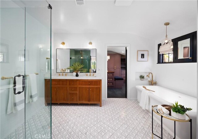 bathroom with vanity and separate shower and tub