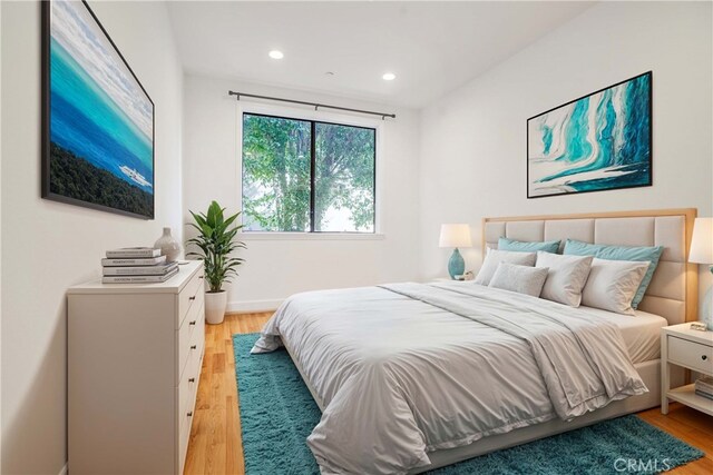 bedroom featuring light hardwood / wood-style floors