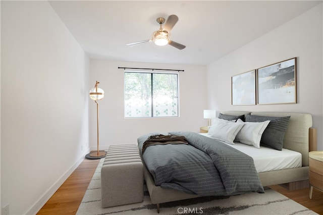 bedroom featuring ceiling fan and light hardwood / wood-style flooring