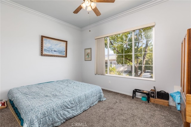 carpeted bedroom featuring crown molding and ceiling fan