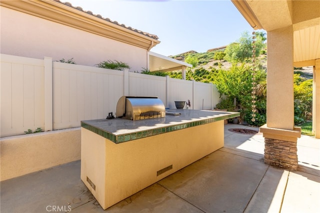 view of patio / terrace with a grill and area for grilling