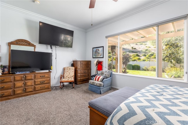 bedroom with ceiling fan, crown molding, and carpet flooring