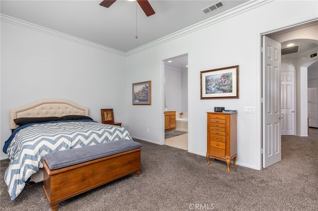 carpeted bedroom featuring crown molding, ensuite bathroom, and ceiling fan