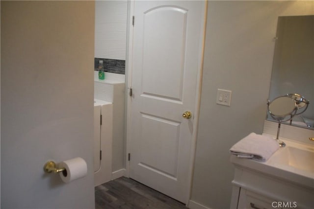 bathroom with vanity and wood-type flooring