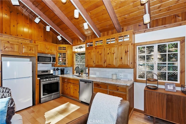 kitchen featuring wooden ceiling, sink, light wood-type flooring, light stone counters, and stainless steel appliances