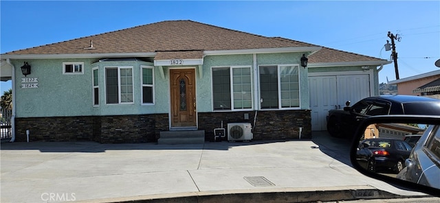 view of front of property featuring ac unit