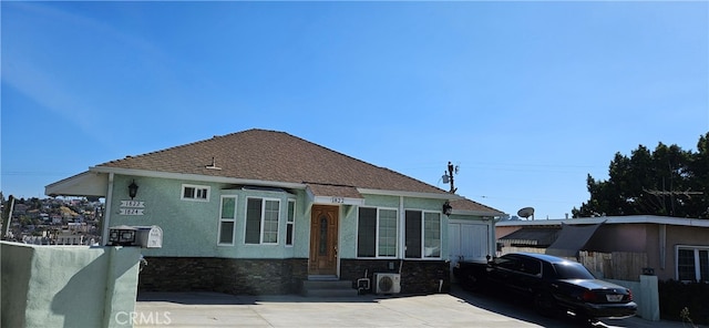 view of front of house with ac unit