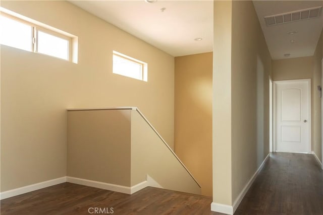 hallway with dark hardwood / wood-style floors