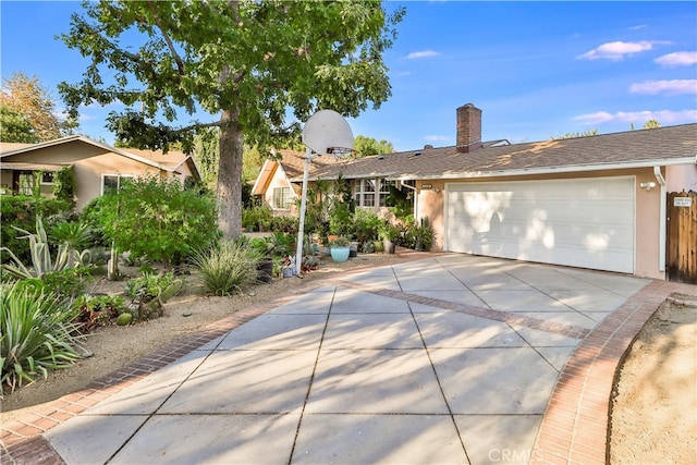 ranch-style house featuring a garage