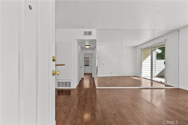 interior space with dark hardwood / wood-style floors