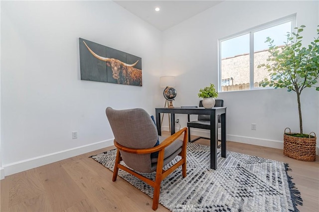 home office with light hardwood / wood-style floors