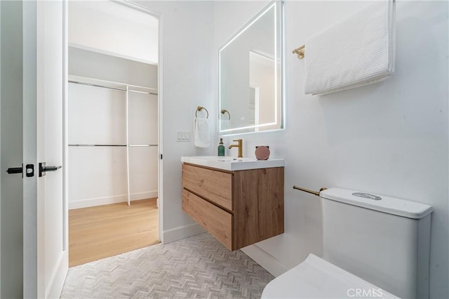 bathroom featuring vanity and wood-type flooring