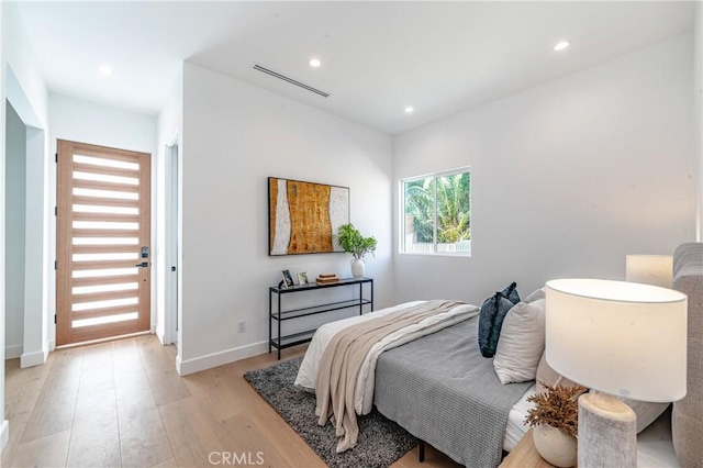 bedroom featuring light wood-type flooring