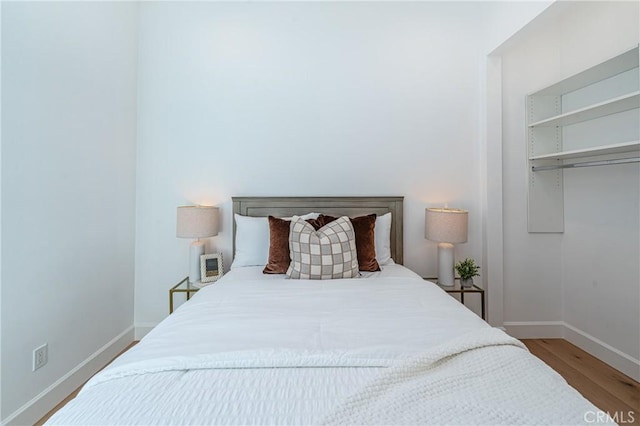 bedroom with a closet and wood-type flooring