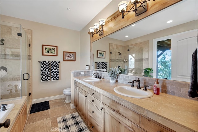 bathroom with decorative backsplash, vanity, walk in shower, tile patterned floors, and toilet