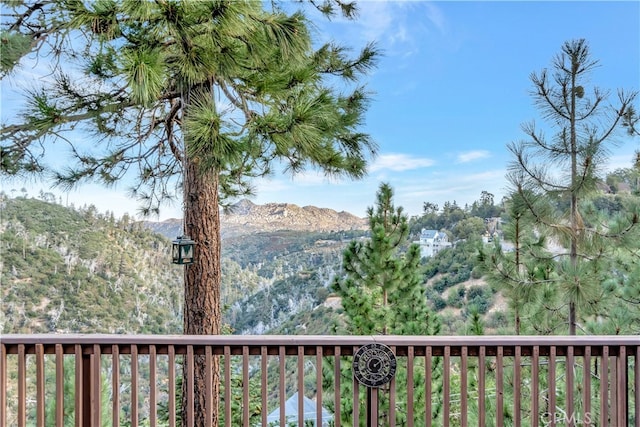 wooden terrace featuring a mountain view